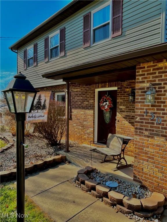 130 Rauch Dr, Marietta, OH 45750 - view of exterior entry with a patio