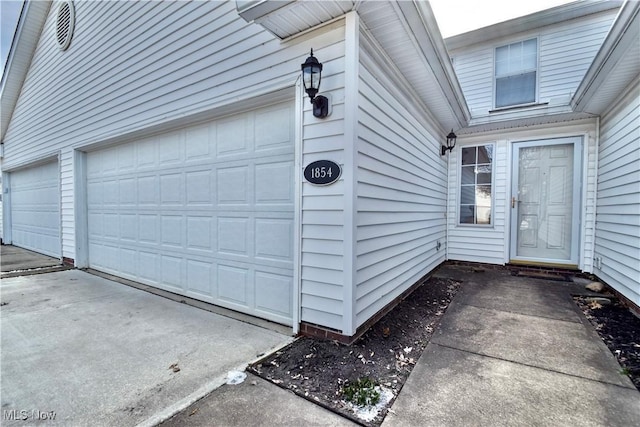 doorway to property featuring a garage