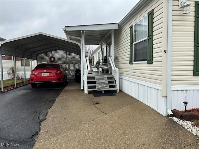 view of vehicle parking with a carport