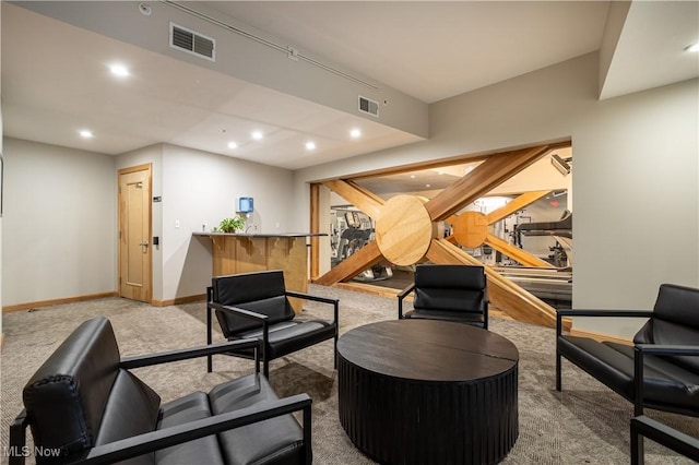 living area with indoor wet bar, visible vents, recessed lighting, and carpet flooring