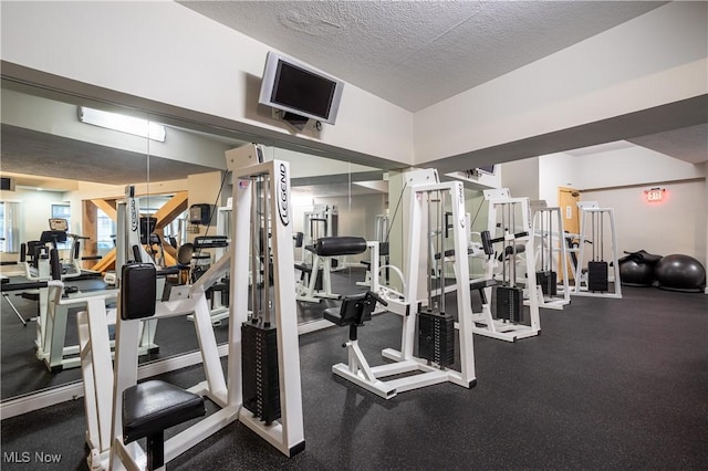workout area with a textured ceiling