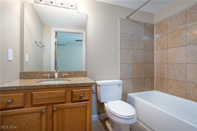 full bathroom featuring washtub / shower combination, vanity, and toilet