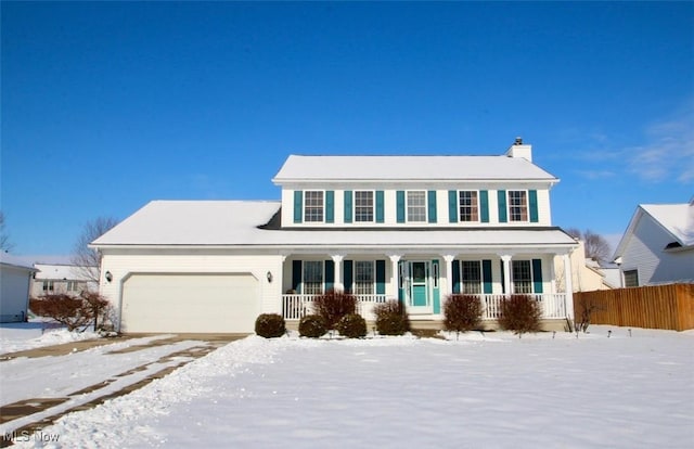 view of front facade with a garage and a porch