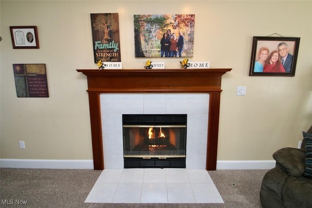 details featuring carpet floors and a tile fireplace