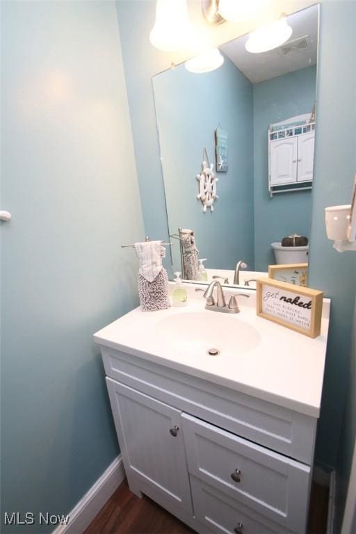 bathroom with vanity and hardwood / wood-style floors