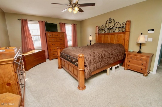 bedroom with light colored carpet and ceiling fan