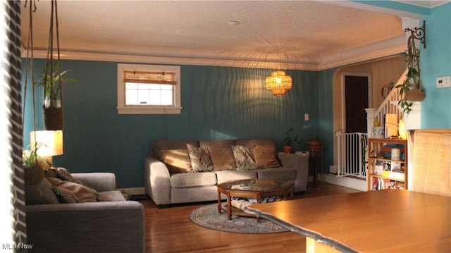 living room with crown molding, radiator heating unit, and hardwood / wood-style floors