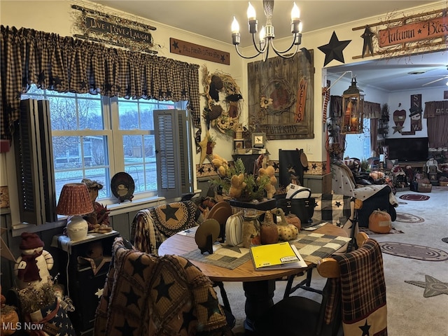 carpeted dining area with crown molding and an inviting chandelier