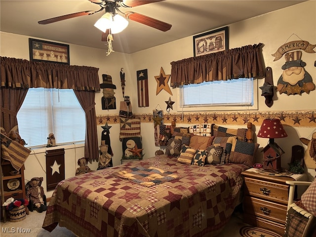 carpeted bedroom with ceiling fan