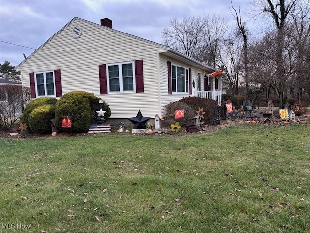 view of property exterior featuring a lawn