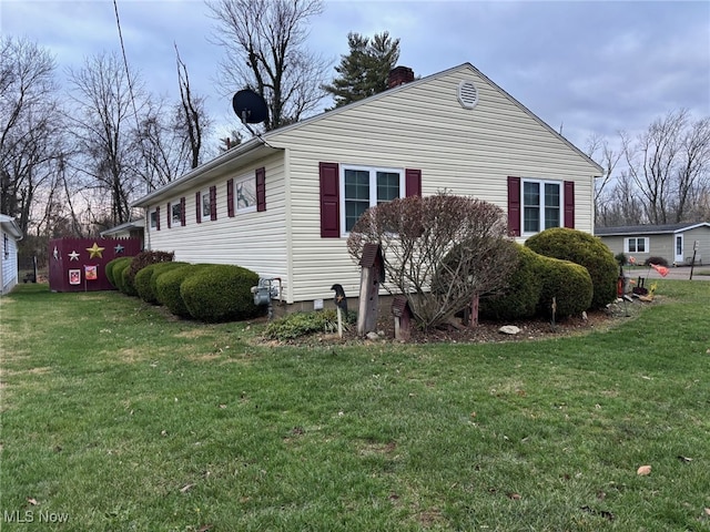 view of home's exterior featuring a yard