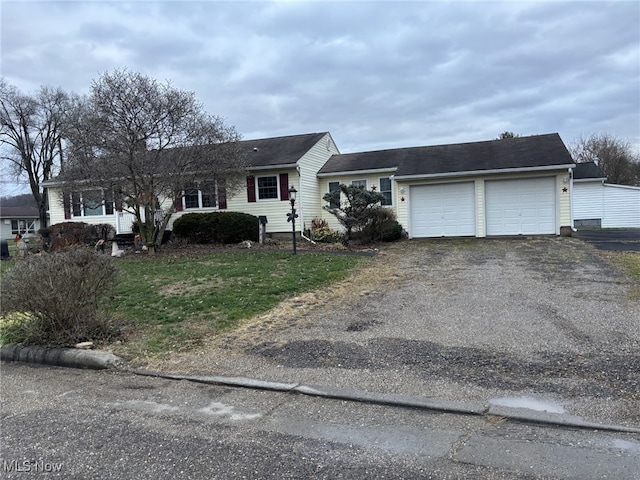 single story home with a garage