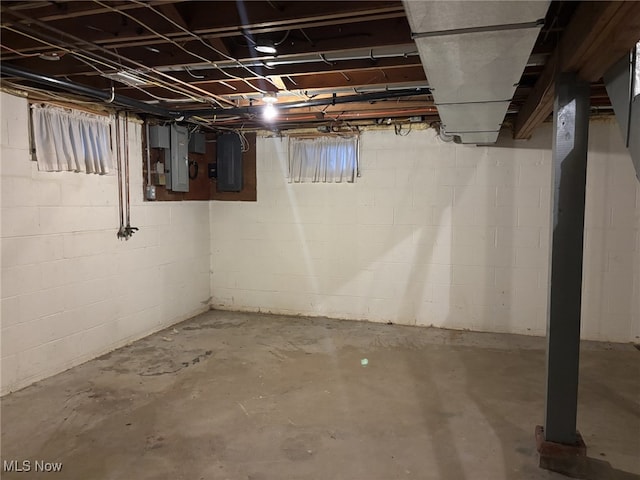 basement featuring electric panel