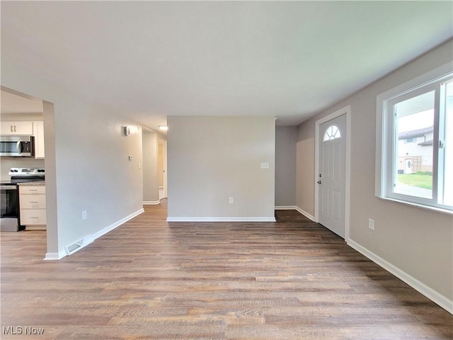 unfurnished living room featuring light wood-type flooring