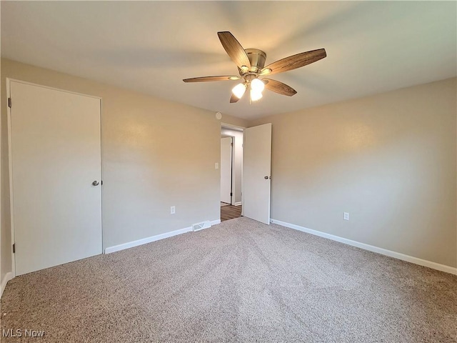 empty room with carpet and ceiling fan