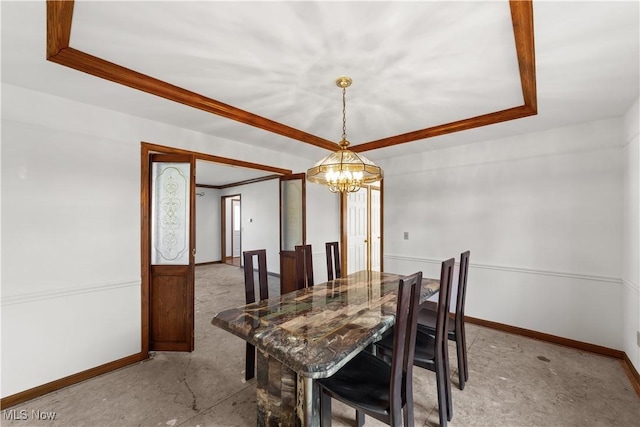 34210 Beacon Dr, Willoughby, OH 44094 - dining space featuring crown molding, a raised ceiling, and a chandelier