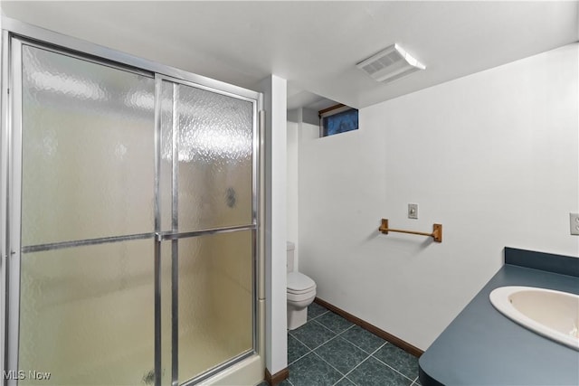 34210 Beacon Dr, Willoughby, OH 44094 - bathroom with a shower with door, vanity, tile patterned floors, and toilet