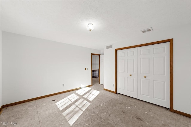 34210 Beacon Dr, Willoughby, OH 44094 - unfurnished bedroom featuring a closet and a textured ceiling