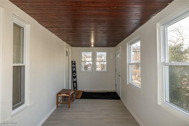 entryway with wood ceiling and hardwood / wood-style flooring