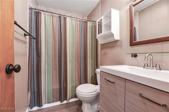 full bathroom with vanity, toilet, shower / tub combo, and wood-type flooring