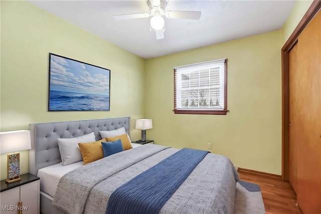 bedroom featuring hardwood / wood-style floors and ceiling fan