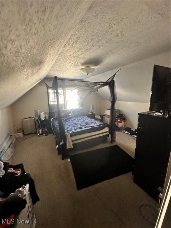 carpeted bedroom featuring vaulted ceiling and a textured ceiling