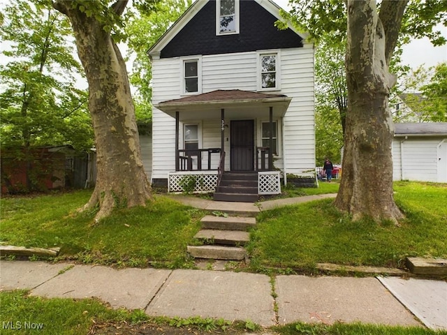 view of front of house featuring a front yard and covered porch