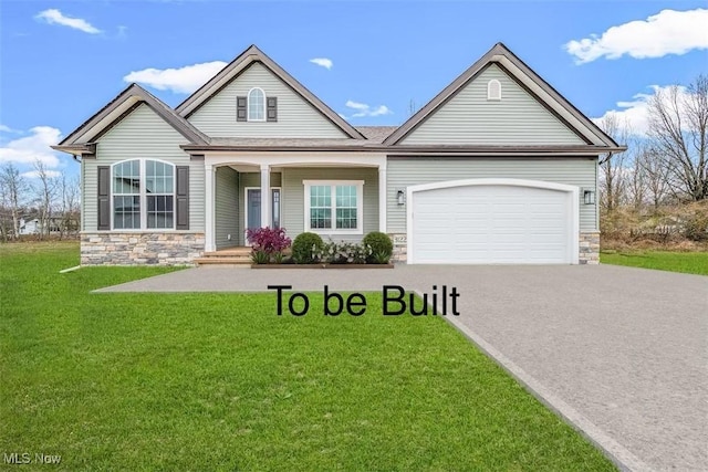 3177 Azalea Ridge Rd, Perry, OH 44081 - view of front of house with stone siding, asphalt driveway, a front yard, covered porch, and a garage