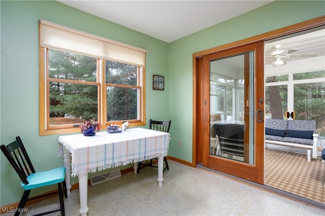 dining room with a wealth of natural light and ceiling fan