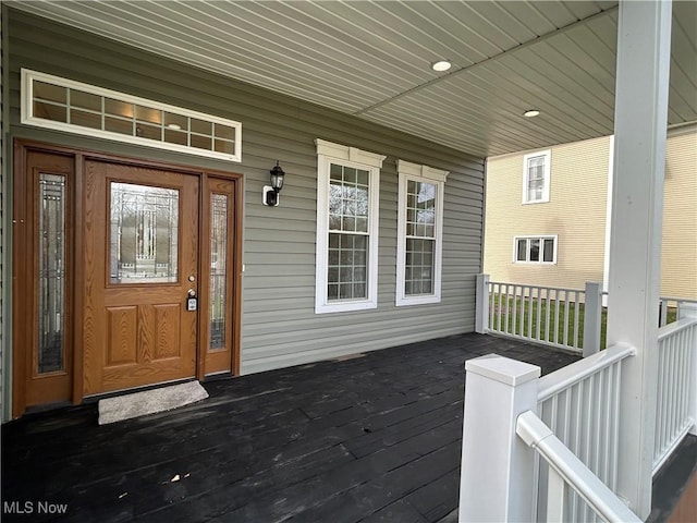 doorway to property featuring covered porch