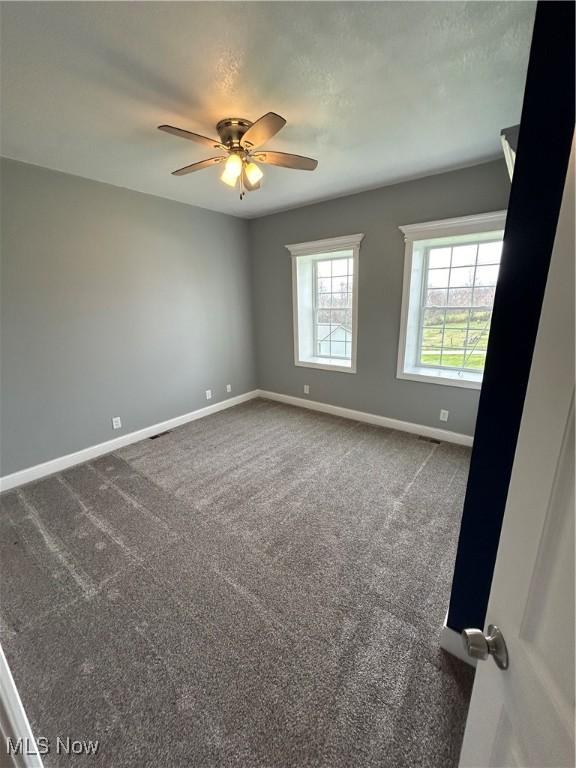 10545 Main St, Norwich, OH 43767 - carpeted empty room featuring ceiling fan
