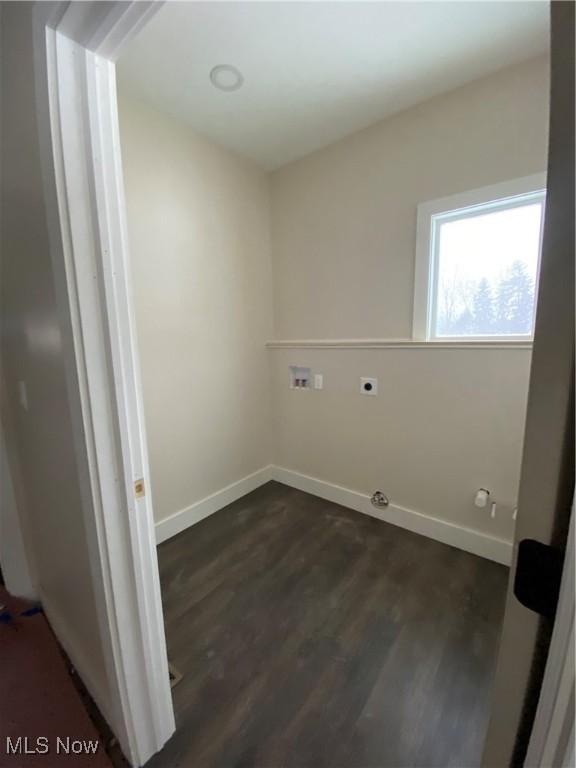 laundry room featuring dark wood-type flooring, washer hookup, hookup for a gas dryer, and electric dryer hookup