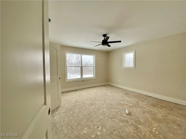 unfurnished room with ceiling fan