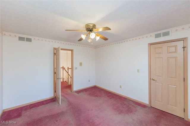 carpeted empty room with ceiling fan