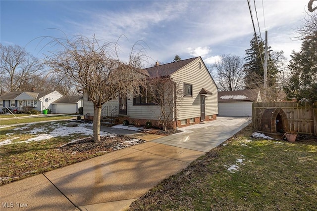 view of home's exterior featuring a garage, an outbuilding, and a lawn