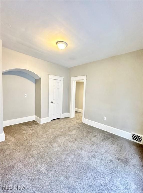 unfurnished room featuring carpet flooring