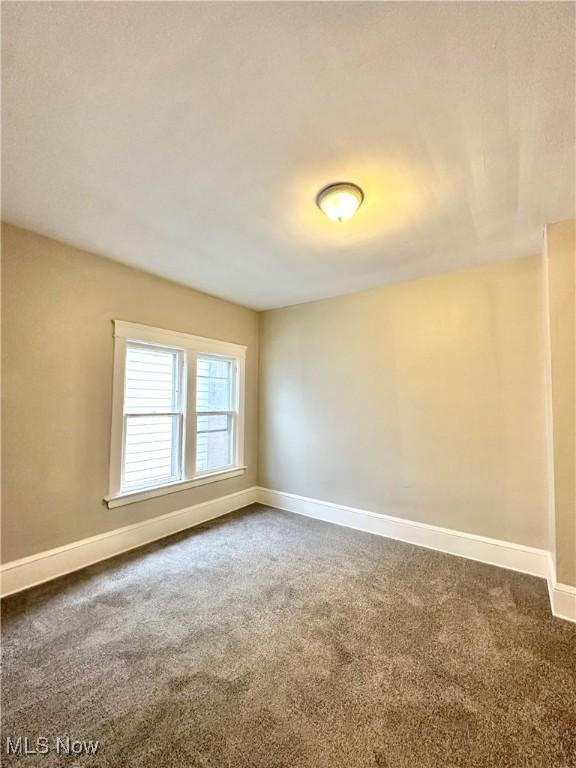 empty room featuring carpet floors