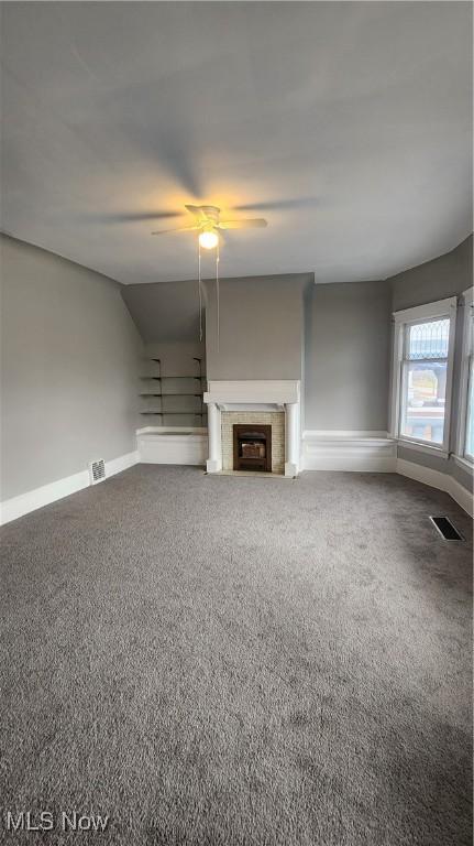 unfurnished living room with carpet