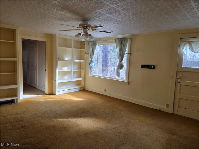 unfurnished living room featuring light carpet and ceiling fan