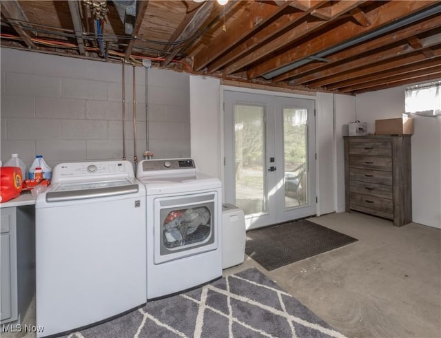 washroom with washer and dryer