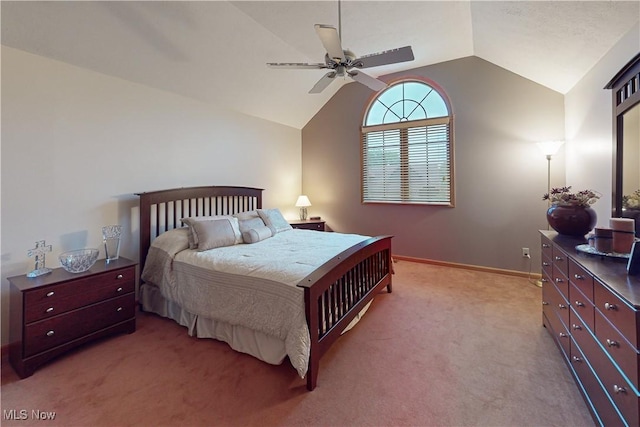 bedroom featuring vaulted ceiling, light colored carpet, and ceiling fan