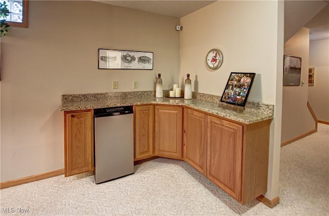 bar with light colored carpet and light stone countertops