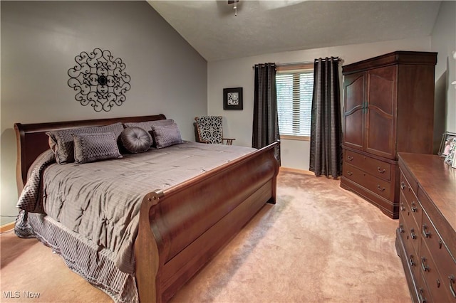 carpeted bedroom featuring vaulted ceiling