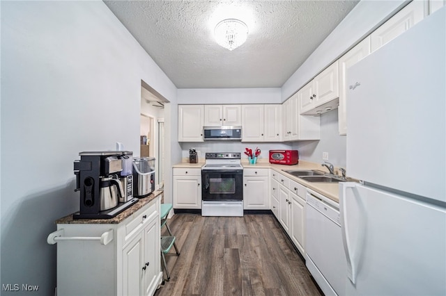 kitchen featuring sink, a textured ceiling, dark hardwood / wood-style flooring, white appliances, and white cabinets