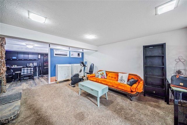 living room featuring carpet floors and a textured ceiling