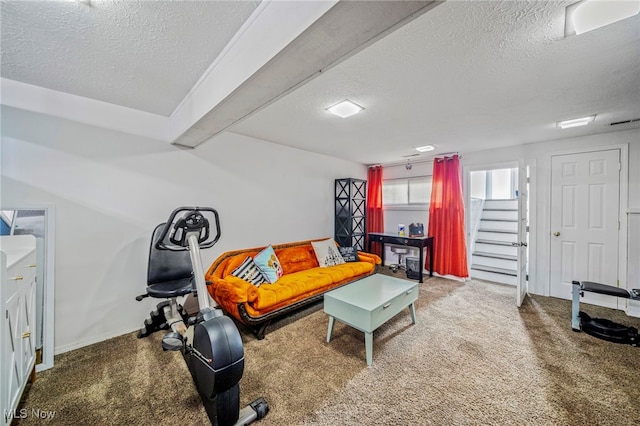 living room featuring carpet and a textured ceiling