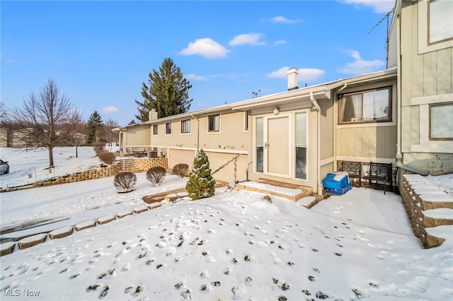 view of snow covered house