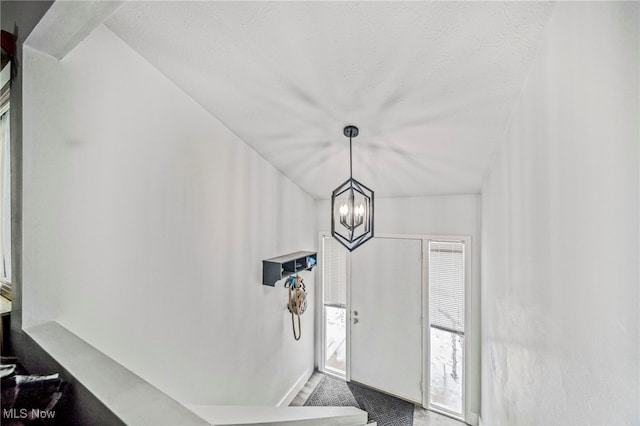 foyer featuring a notable chandelier