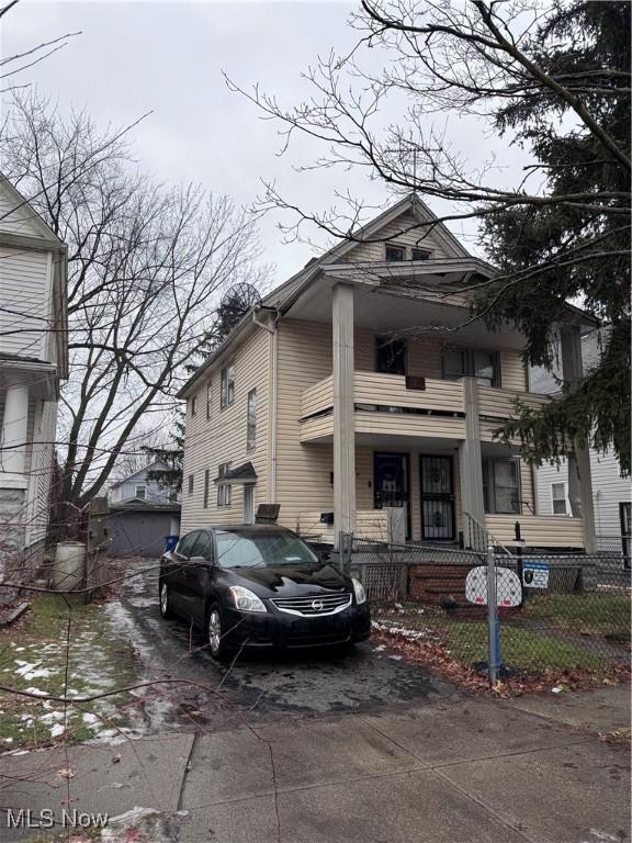 2786 E 119th St, Cleveland, OH 44120 - view of front facade with concrete driveway, covered porch, and a fenced front yard