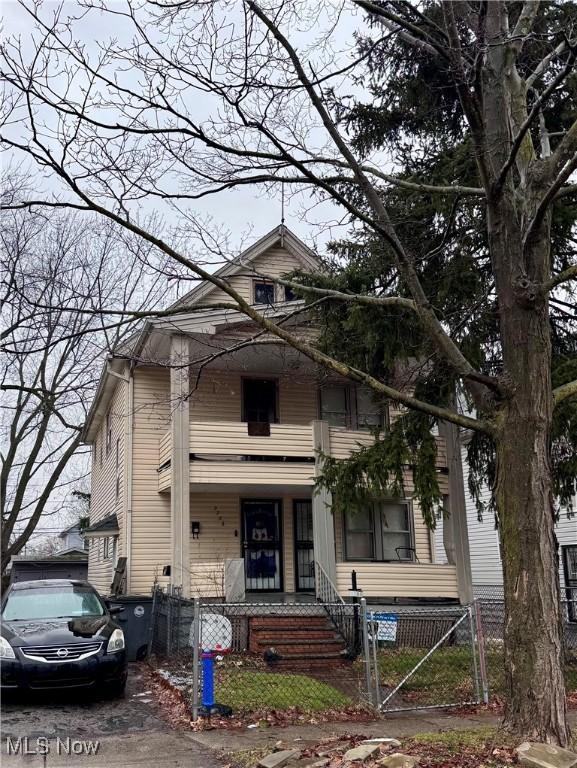 2786 E 119th St, Cleveland, OH 44120 - traditional style home with a fenced front yard, a porch, and a gate